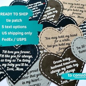 May include: A collection of heart-shaped leather patches with various messages, including "I'll love you forever", "You may hold my hand for a while, but you hold my heart forever", and "I'm so very proud of you". The patches are ready to ship and come in five text options. US shipping only via FedEx or USPS.