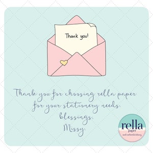 May include: A pink envelope with a handwritten note that says "Thank you!" inside. The envelope has a small gold heart on the front. Below the envelope is text that says "Thank you for choosing rella paper for your stationery needs. blessings. Missy." and a circular logo that says "rella paper sweet's sentimental stationery".