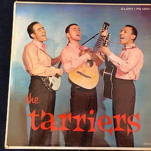 May include: Vintage album cover featuring three men in pink shirts and black pants, each holding a musical instrument. One plays a banjo, and the others play acoustic guitars. The album title "the tarriers" is in red script.
