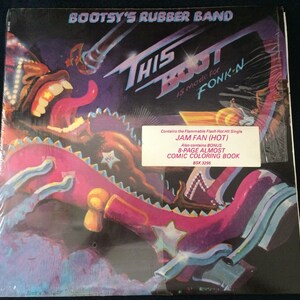 May include: Album cover for Bootsy's Rubber Band, titled "This Boot Is Made for Fonk-N." The artwork features a cartoonish, colorful design with a large, open-mouthed character and the text "JAM FAN (HOT)".
