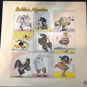Puede incluir: Portada del álbum "Reckless Abandon" de The David Bromberg Band. La portada presenta una cuadrícula de figuras de dibujos animados en varias poses. El título y el nombre de la banda están en la parte superior. El nombre del artista también es visible.
