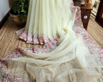 Pastel lemon yellow organza saree with embroidery