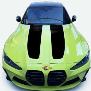 May include: A lime green car with black racing stripes on the hood. The car has a black grill and a black BMW logo.