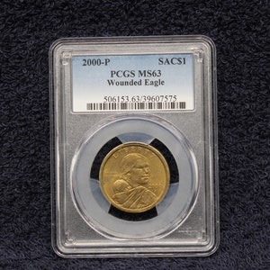 2000-P 1 Dollar PCGS MS63 “Wounded Eagle” Sacagawea Dollar Box #7