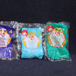 Choice: Ty McDonald&#39;s Teenie Beanie Babies Plush Toy Spunky the Cocker Spaniel OR Rocket The Blue Jay OR  Freckles the Leopard A-2