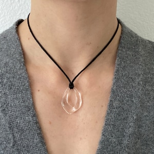 Resin open wavy oval irregular pendant Adjustable black cord necklace clear glass look