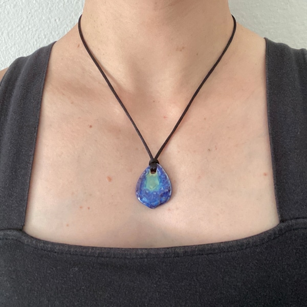 Adjustable black cord necklace with blue green oval abstract wavy ceramic pendant