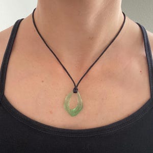Resin open wavy oval irregular pendant Adjustable black cord necklace green