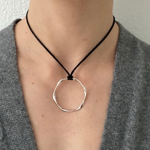 Adjustable black cord necklace with silver wavy hammered open round circle pendant