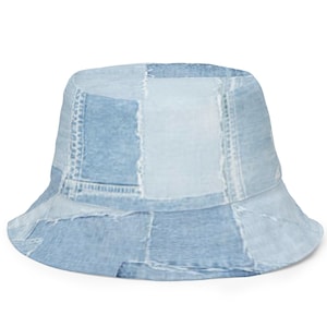 May include: A bucket hat featuring a light blue denim patchwork design. The hat is constructed from various shades of blue denim fabric pieces stitched together, creating a textured, multi-tonal appearance across the crown and the brim.