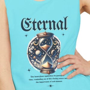 May include: A light blue tank top with the word "Eternal" in a decorative font. The tank top features an hourglass design with celestial elements. The hourglass is set against a backdrop of clouds and stars.