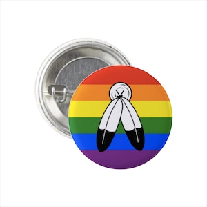 May include: A rainbow pride flag button with a white feather design in the center.
