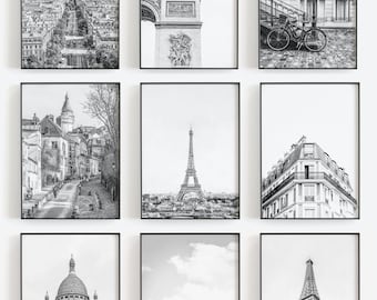 May include: Nine black and white framed photographs of various Parisian landmarks, including the Eiffel Tower, the Arc de Triomphe, and the Sacré-Cœur Basilica.