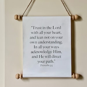 May include: White canvas scroll with the text "Trust in the Lord with all your heart, and lean not on your own understanding. In all your ways acknowledge Him, and He will direct your path." Proverbs 3:5