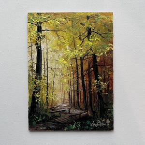 May include: Oil painting depicting a forest scene with a path and a wooden bridge. The trees have dark brown trunks and yellow-green leaves. The painting has a warm colour palette, with light filtering through the trees.