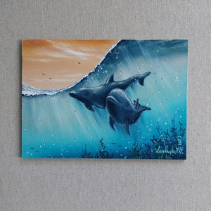 Dolphin Love Original oil painting. Two dolphins frolic in clear waters beneath an orange sky, whimsical dance against vibrant horizon Art