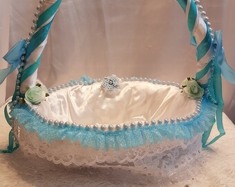 Blue and white satin wicker basket, with lace, flowers and pearls