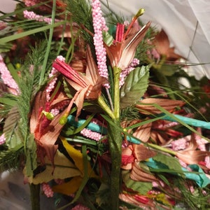 Stems bouquet of various artificial flowers, fabrics