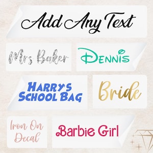 May include: A collection of iron-on decals with various text, including "Add Any Text", "Mrs. Baker", "DENNIS", "HARRY'S SCHOOL BAG", "Bride", "Iron On Decal", and "Barbie Girl".