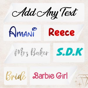 May include: A collection of iron-on name labels with different fonts and colours. The labels include the names "Amani", "Reece", "Mrs. Baker", "S.D.K", "Bride", and "Barbie Girl".