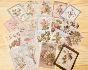 May include: A collection of vintage-style paper stamps featuring floral and botanical illustrations. The stamps showcase roses, tulips, and other flowers in soft pastel colors, with some including numbers and text.
