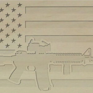 May include: A wooden sign with a silhouette of a rifle superimposed on an American flag.