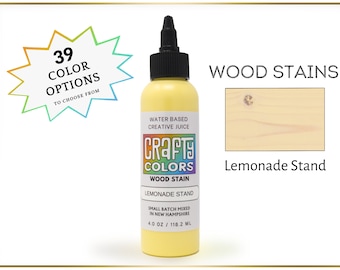 May include: A 4 ounce bottle of water-based wood stain in the color Lemonade Stand. The bottle is labeled "Crafty Colors Wood Stain" and features a yellow starburst with the text "39 Color Options to Choose From".