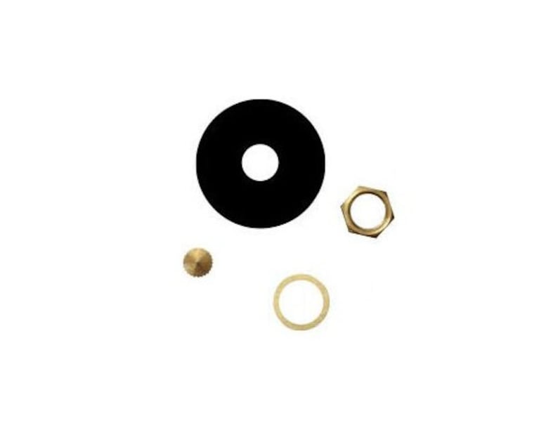 May include: A set of four small metal parts for a watch. The set includes a black round disc, a gold-colored ring, a gold-colored nut, and a gold-colored pin.