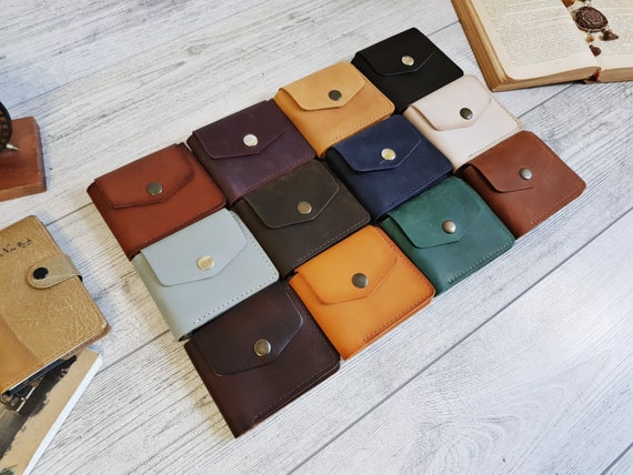 Monogram-embossed billfold wallet in grained leather