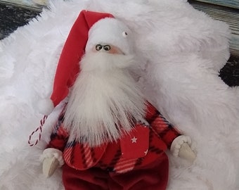 Santa doll toy in tilda style for Christmas and New year