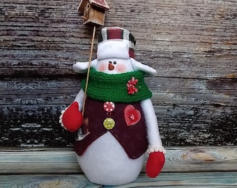 Snowman plush toy in clothes