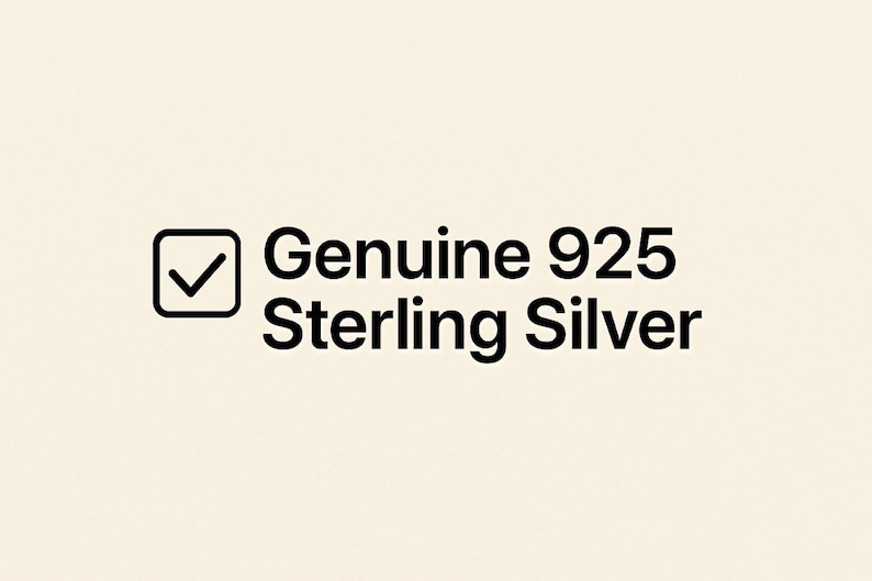 May include: The image displays the text "Genuine 925 Sterling Silver" in black, with a tick inside a square box. The background is a plain, light beige colour. The text indicates the product is made of sterling silver.
