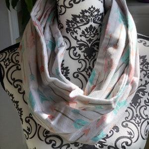 Hand made infinity scarf, pink and blue arrows on a light gray flannel fabric, super soft!