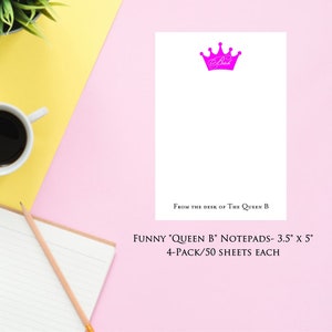 May include: A set of four pink and white notepad sets with a pink crown and the text "From the desk of The Queen B" and "FUNNY 'QUEEN B' NOTEPADS - 3.5" x 5" 4-PACK/50 SHEETS EACH".