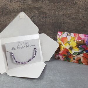 Geschenk Armband Karte mit Spruch Du bist die beste Mama zum Geburtstagsgeschenk Glücksbringer Lila Glücksarmband