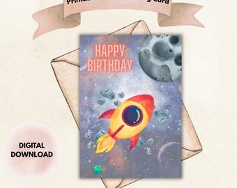 May include: A printable 5" x 7" greeting card with a space theme. The card features a yellow and red rocket ship, planets, and the words "Happy Birthday." The words "Digital Download" are also visible.