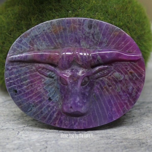 Sugilite with splashes of richterite and bustamite water buffalo oval relief carving