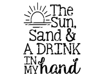 May include: Black and white graphic with the text "The Sun, Sand & A DRINK IN MY hand". The design includes a sun with rays and a horizon line, evoking a beach theme.