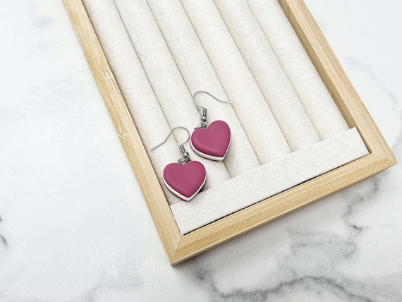 Hyper-realistic polymer clay macaron earrings so detailed you'd want to eat them — tiny wearable pastry art.