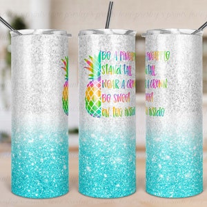 May include: A white and blue glitter tumbler with a pineapple graphic and the text "Be a pineapple, stand tall, wear a crown, be sweet on the inside".