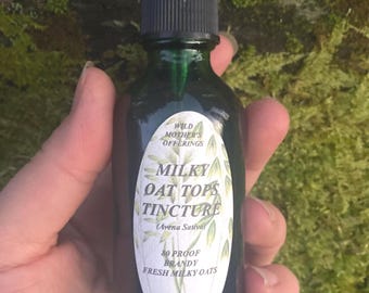 May include: A 2 ounce bottle of Milky Oat Tops Tincture made with 80 proof brandy and fresh milky oats. The bottle is green glass with a black dropper and a white label with black text.