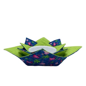 May include: A green and blue fabric bowl with a flamingo print. The bowl is folded and has a white bowl inside.