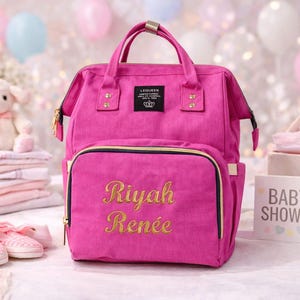 Pink diaper bag with gold thread embroidery