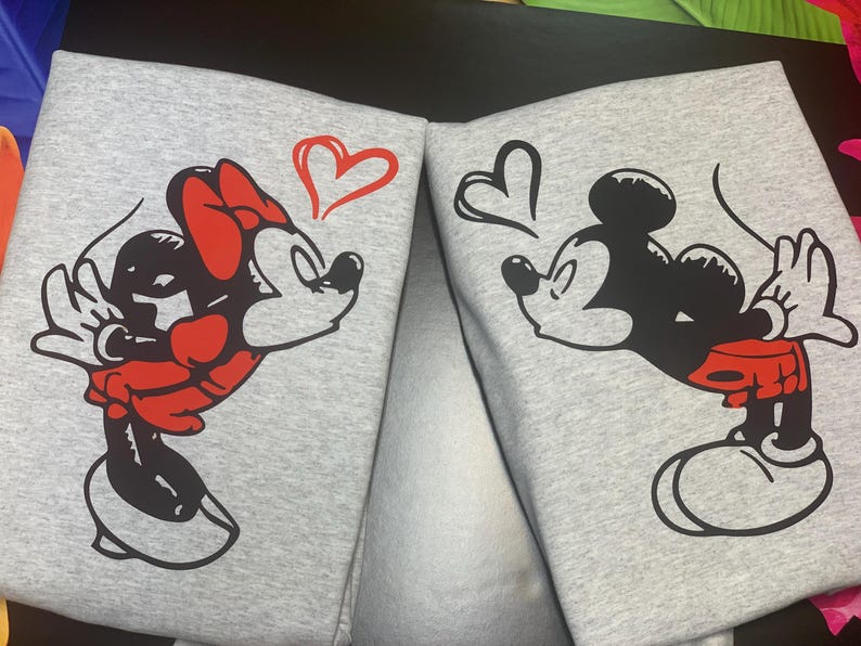 couples matching valentines day hoodie with Disney design and initials on sleeve.