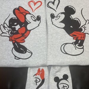 ash sweatshirt with minnie and mickey mouse on front and initials on the sleeve