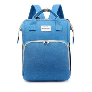 May include: A blue diaper bag backpack with a zippered pocket and the text "You are my sunshine" on the front.