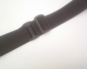 velcro fastening  black elastic belts fully adjustable p v c  slider bar to fit 30 to 44 inch waist