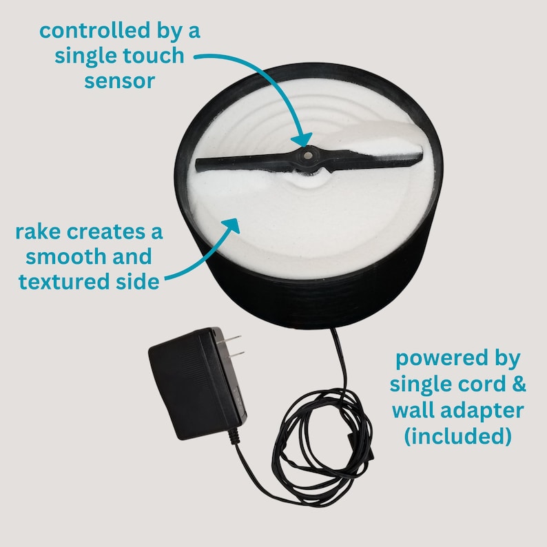 May include: A black and white electric snow cone maker with a single touch sensor. The snow cone maker has a rake that creates a smooth and textured side. The snow cone maker is powered by a single cord and wall adapter (included).