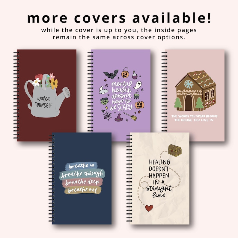a collection of five spiral notebooks with various cover designs and text. The text on the notebooks includes phrases such as "water yourself", "mental health matters", "healing doesn't happen in a straight line", and "the house you live in". The notebooks are arranged in a row, with the first one being a dark red notebook and the last one being a light pink notebook. The text on the notebooks is clear and easy to read.