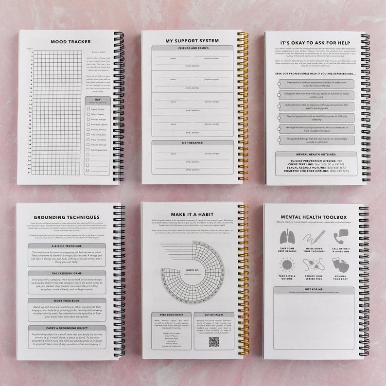 six spiral-bound notebooks with various prompts and exercises for self-reflection and personal growth.